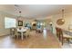 Open living area with hardwood floors, dining, and kitchen at 6933 Quiet Creek Dr, Bradenton, FL 34212