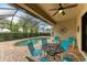 Relaxing screened pool area with patio furniture at 6933 Quiet Creek Dr, Bradenton, FL 34212