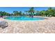 Large resort-style pool with plenty of lounge chairs at 6933 Quiet Creek Dr, Bradenton, FL 34212