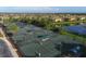 Community tennis courts with multiple courts and players at 6933 Quiet Creek Dr, Bradenton, FL 34212