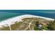 Aerial view of beachfront property with home and private beach access at 727 Holly Rd, Anna Maria, FL 34216
