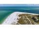 Beachfront property with private beach access, seen from above at 727 Holly Rd, Anna Maria, FL 34216