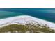 Aerial view of a secluded beach with calm ocean water at 727 Holly Rd, Anna Maria, FL 34216