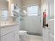 Clean bathroom with a walk-in shower and white vanity at 727 Holly Rd, Anna Maria, FL 34216