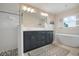Spa-like bathroom with soaking tub and walk-in shower at 727 Holly Rd, Anna Maria, FL 34216