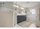Elegant bathroom with double vanity and soaking tub at 727 Holly Rd, Anna Maria, FL 34216