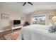 Comfortable bedroom with TV and relaxing seating at 727 Holly Rd, Anna Maria, FL 34216