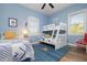 bedroom with twin beds, bunk beds and a full bathroom at 727 Holly Rd, Anna Maria, FL 34216