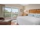 Bright bedroom with king bed and private balcony at 727 Holly Rd, Anna Maria, FL 34216