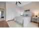Comfortable bedroom with a striped comforter and ample closet space at 727 Holly Rd, Anna Maria, FL 34216