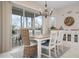 Bright dining room with a table, chairs, and access to a screened porch at 727 Holly Rd, Anna Maria, FL 34216