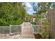 Wooden walkway leads to a private dock, perfect for enjoying waterfront views at 727 Holly Rd, Anna Maria, FL 34216