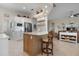 Modern kitchen with white cabinets, breakfast bar, and stainless steel appliances at 727 Holly Rd, Anna Maria, FL 34216
