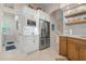 Modern kitchen with stainless steel appliances and white cabinetry at 727 Holly Rd, Anna Maria, FL 34216