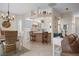 Open concept kitchen with island seating and white cabinets at 727 Holly Rd, Anna Maria, FL 34216