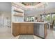 Modern kitchen with wood cabinetry, stainless steel appliances, and an island at 727 Holly Rd, Anna Maria, FL 34216
