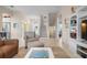 Bright and airy living room with a staircase at 727 Holly Rd, Anna Maria, FL 34216