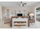 Living room with a comfortable sofa and white media console at 727 Holly Rd, Anna Maria, FL 34216