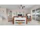 Living room with a comfortable sofa and white media console at 727 Holly Rd, Anna Maria, FL 34216