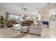 Bright and airy living room with a view into the kitchen and dining area at 727 Holly Rd, Anna Maria, FL 34216