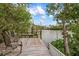 Relaxing wooden deck overlooking the calm waters, ideal for enjoying the view at 727 Holly Rd, Anna Maria, FL 34216