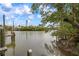 Serene waterfront view with peaceful waters and lush greenery at 727 Holly Rd, Anna Maria, FL 34216