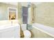 Clean bathroom with a toilet, sink, and shower/tub combo at 752 Tropical Cir, Sarasota, FL 34242