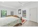 Bright bedroom with a king-size bed and garden views at 752 Tropical Cir, Sarasota, FL 34242