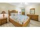 Bedroom with wooden furniture and coastal bedding, creating a relaxing atmosphere at 752 Tropical Cir, Sarasota, FL 34242
