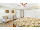 Relaxing bedroom with two armchairs and ensuite bathroom access at 752 Tropical Cir, Sarasota, FL 34242