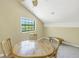 Bright dining area with round table and four chairs, offering a cozy space at 752 Tropical Cir, Sarasota, FL 34242