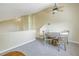 Simple dining area with round table and four chairs near a railing at 752 Tropical Cir, Sarasota, FL 34242