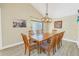 Spacious dining room featuring a large wooden table with ample seating at 752 Tropical Cir, Sarasota, FL 34242