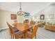 Bright dining room with large table, seating for eight, and views into the living room at 752 Tropical Cir, Sarasota, FL 34242