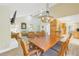 Spacious dining room with a chandelier and kitchen access at 752 Tropical Cir, Sarasota, FL 34242
