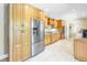 Kitchen boasts stainless steel appliances and light wood cabinets at 752 Tropical Cir, Sarasota, FL 34242