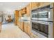 Laundry room with washer, dryer, and ample storage shelving at 752 Tropical Cir, Sarasota, FL 34242