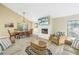 Spacious living area with vaulted ceiling and large windows at 752 Tropical Cir, Sarasota, FL 34242