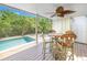 Refreshing pool area with patio furniture and lush landscaping at 752 Tropical Cir, Sarasota, FL 34242