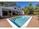 Relaxing pool area with deck and patio furniture at 752 Tropical Cir, Sarasota, FL 34242