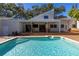 Inviting pool with spacious patio and extended deck at 752 Tropical Cir, Sarasota, FL 34242