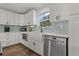 Updated kitchen, featuring white Shaker cabinets and a farmhouse sink at 7565 64Th E Ct, Palmetto, FL 34221