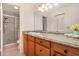Bathroom with granite countertop and walk-in shower at 764 Avenida Estancia # 208, Venice, FL 34292