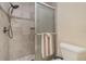 Bathroom with shower stall and tile surround at 764 Avenida Estancia # 208, Venice, FL 34292