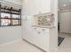 White kitchen cabinets and granite countertops at 764 Avenida Estancia # 208, Venice, FL 34292