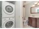 Laundry room with stacked washer and dryer at 764 Avenida Estancia # 208, Venice, FL 34292