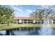 Community pond with fountain in front of condo building at 764 Avenida Estancia # 208, Venice, FL 34292