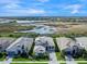 Luxury home community with preserve and lake views; single-Gathering home with tile roof at 8050 Redonda Loop, Lakewood Ranch, FL 34202