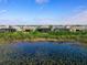 Community view with lakefront homes and lush landscape at 8050 Redonda Loop, Lakewood Ranch, FL 34202
