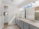 Elegant bathroom with double vanity and a large mirror at 8050 Redonda Loop, Lakewood Ranch, FL 34202